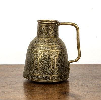 Lot 629 - Qajar inlaid brass jug Iran with panels of...