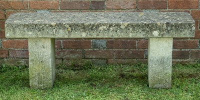 Lot 1358 - A carved stone bench with foliate designs