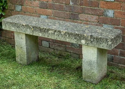 Lot 1358 - A carved stone bench with foliate designs