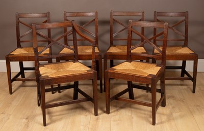 Lot 122 - A set of six Regency oak cross-back dining chairs