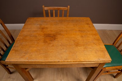 Lot 157 - A 'Utility' fold over dining table and chairs