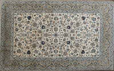 Lot 1064 - A cream ground large Kashan