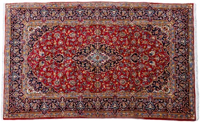 Lot 221 - A red ground Kashan