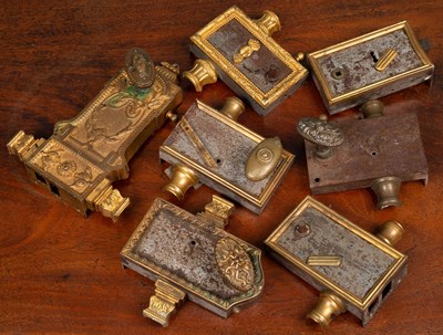 Lot 113 - A collection of seven gilt metal French door catches