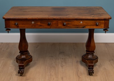 Lot 257 - A 19th century rosewood writing table