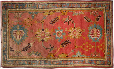 Lot 368 - A Turkish red and green ground rug 125cm x 215cm.