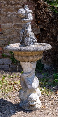 Lot 1349 - A carved marble fountain surmounted by a boy holding a fish