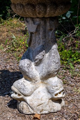 Lot 1349 - A carved marble fountain surmounted by a boy holding a fish