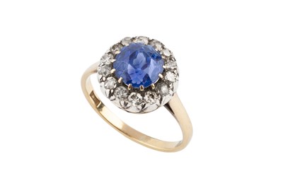 Lot 97 - A sapphire and diamond cluster ring, the...