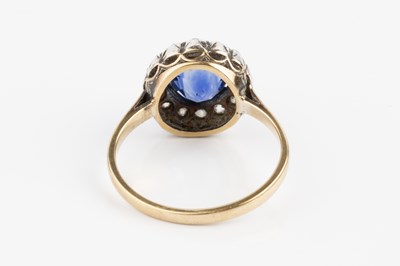 Lot 97 - A sapphire and diamond cluster ring, the...
