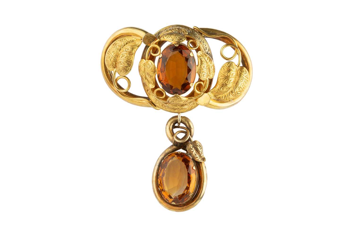 Lot 41 - A Victorian citrine panel brooch, the hollow...