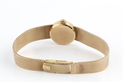 Lot 262 - A lady's 9ct gold bracelet watch by Tissot,...