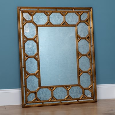 Lot 182 - A modern gilt fretwork framed rectangular wall mirror