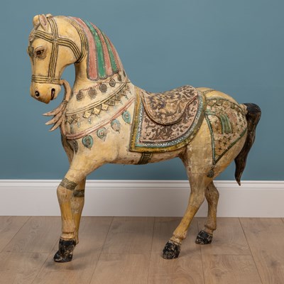 Lot 387 - A carved and painted wooden fairground-style horse