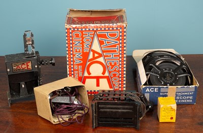 Lot 455 - A Pathéscope "ACE" Home Projector with two 9.5mm Pathéscope films; together with an early emergency hand flying kite