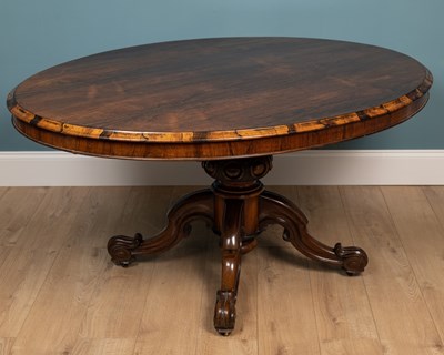 Lot 279 - A Victorian rosewood oval tilt-top centre table