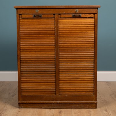 Lot 282 - An oak double tambor fronted filing cabinet