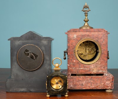 Lot 11 - A Swiss polished metal timepiece and two further mantel clocks