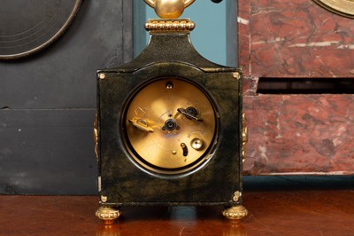 Lot 11 - A Swiss polished metal timepiece and two further mantel clocks