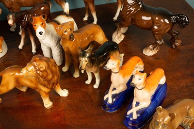 Lot 347 - A Royal Dux porcelain group modelled as two pointer dogs and sixteen further china animal figures