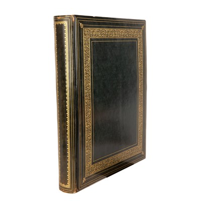 Lot 381 - A gilt tooled leather bound album containing a...