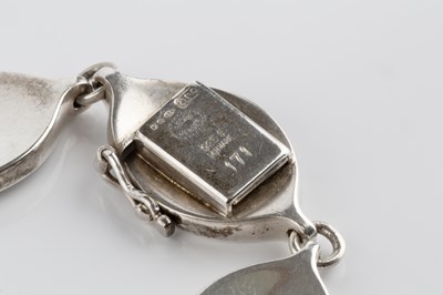 Lot 73 - A silver collar necklace and bracelet suite...