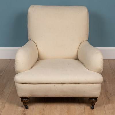 Lot 374 - An old deep armchair in the Howard style