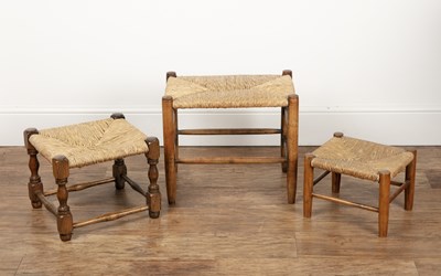 Lot 71 - Cotswold School Three rush seated stools or...