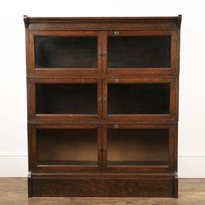 Lot 206 - Oak globe wernicke style bookcase divided into...