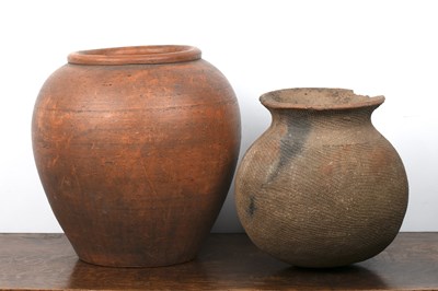 Lot 405 - Two terracotta pots 41.2cm high and 33cm high...