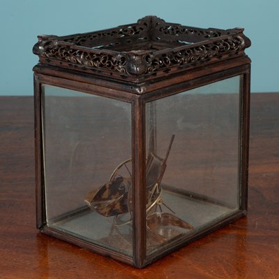 Lot 393 - A small faux tortoiseshell model of a rickshaw; and an Oriental hardwood small display case