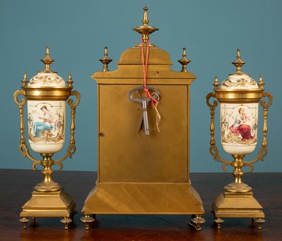 Lot 404 - A garniture de cheminée and further clock parts