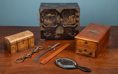 Lot 406 - A Japanese lacquered tabletop cabinet; a set of bellows; a walnut tea caddy; an oak canteen case; and a hardwood till