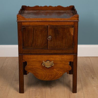 Lot 512 - A 19th century mahogany commode cupboard