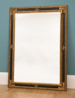 Lot 267 - A contemporary black and gold painted wall mirror