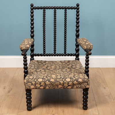 Lot 223 - A 19th century ebonised bobbin chair