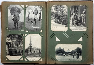 Lot 694 - An early 20th century postcard album...