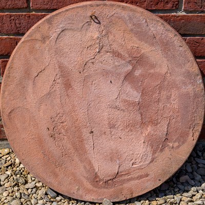 Lot 1246 - A terracotta plaque or roundel