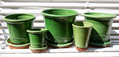 Lot 1271 - A group of five green glazed Whichford Pottery garden plant pots, together with three saucers