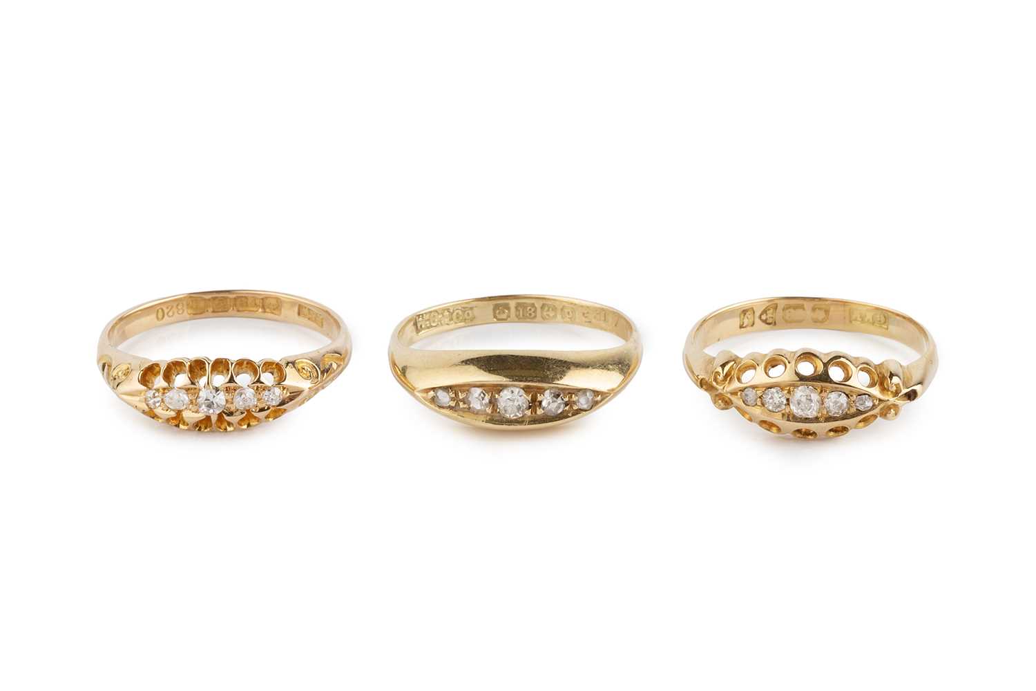 Lot Three diamond five stone rings, set with...