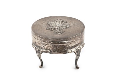 Lot 203 - An Edwardian silver circular trinket box, the...