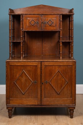 Lot 519 - A Bombay Furniture Company teak cabinet