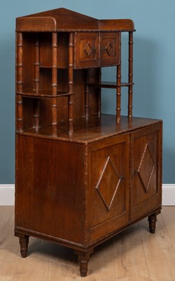 Lot 277 - A Bombay Furniture Company teak cabinet