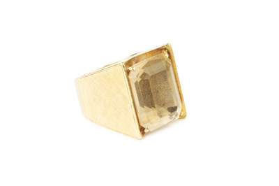 Lot 26 - A citrine single stone dress ring, the...