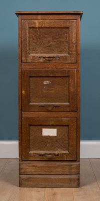 Lot 253 - An early 20th century oak and hardwood three drawer filing cabinet