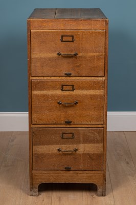 Lot 303 - An early 20th century oak three drawer filing cabinet