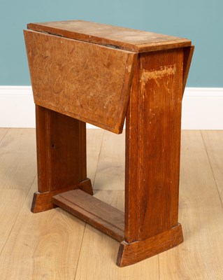 Lot 258 - A Cotswold school small oak drop-leaf table