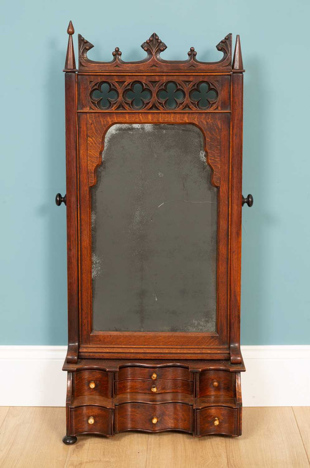 Lot 65 - A 19th century oak gothic style swing dressing table mirror