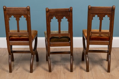 Lot 82 - A set of three Victorian oak chorister's chairs