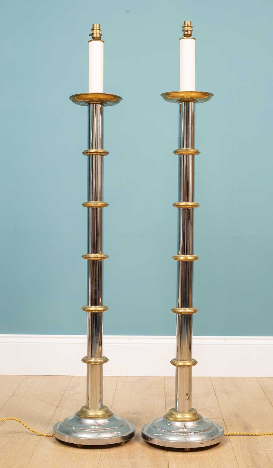 Lot 27 - A pair of brass and chrome floor lamps